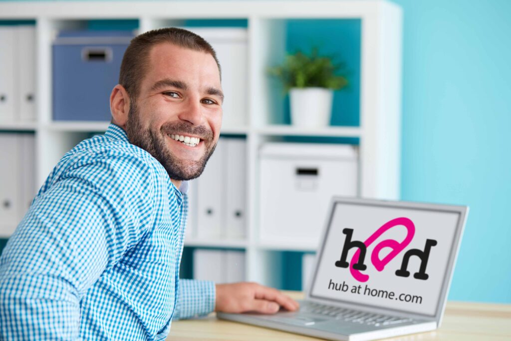 Happy businessman working in modern office on computer